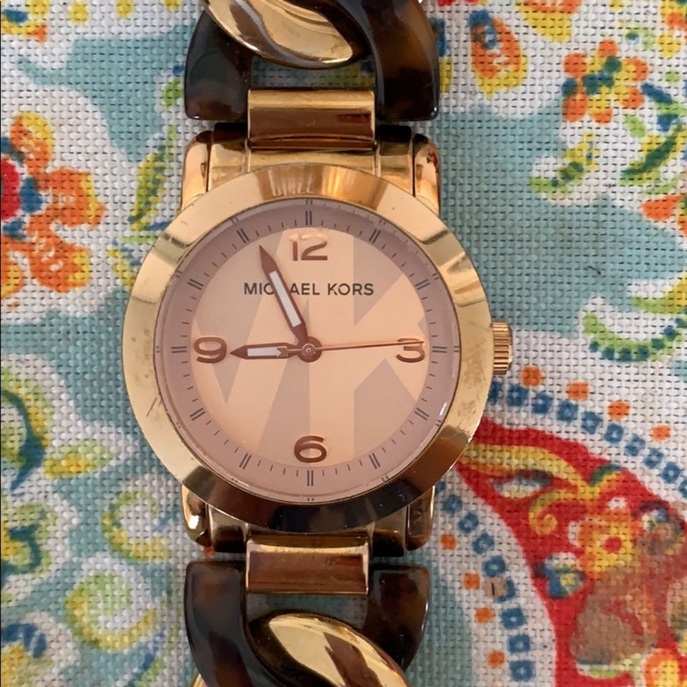 Michael Kohr’s tortoise and gold braided watch